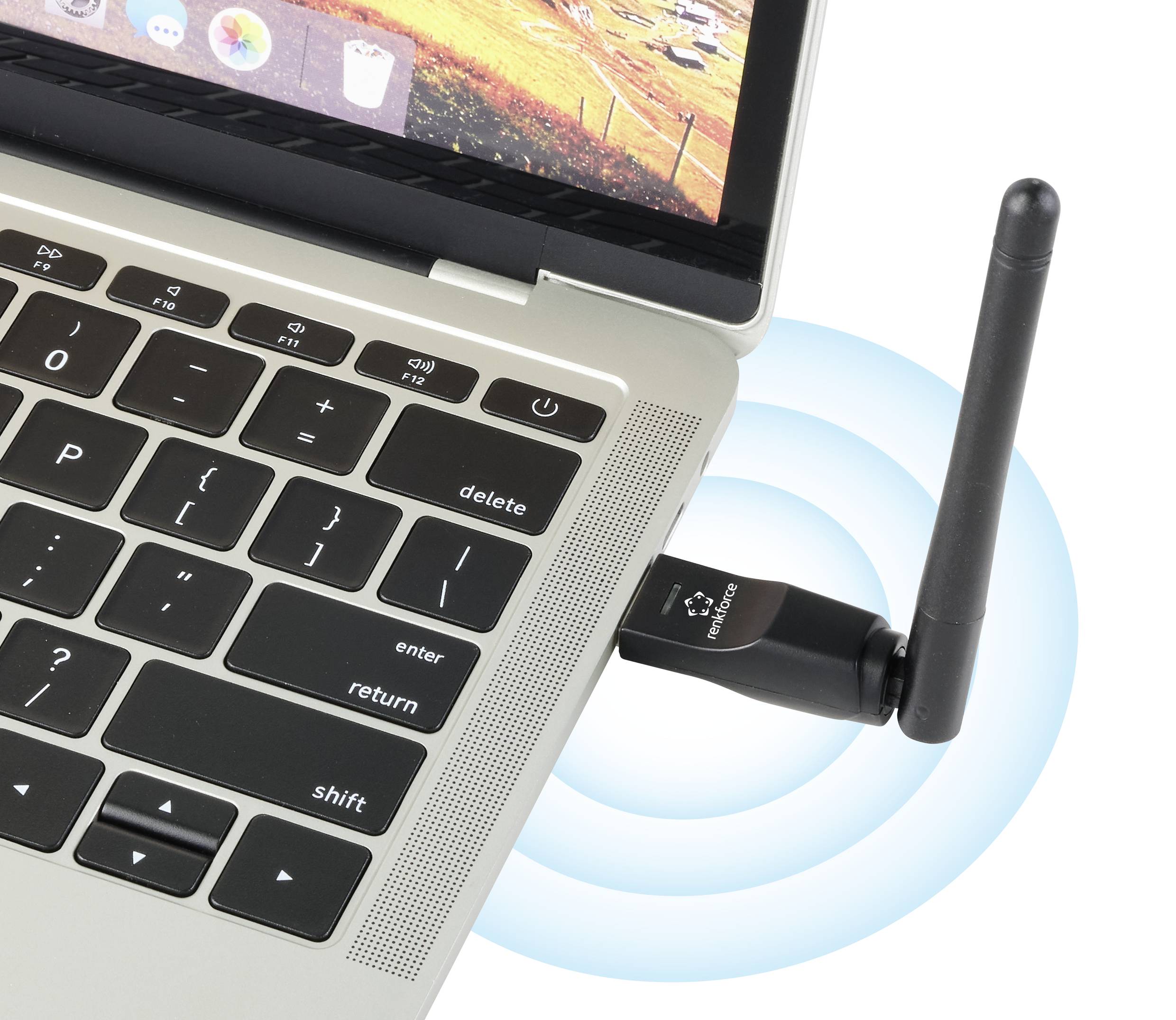 En bärbar dator med en isatt WLAN-adapter. Enheten sänder en radiosignal, märkbar genom blå våglinjer.