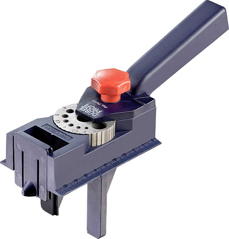 Hålsågshållare med röd vridknapp och linjal, använd för att hålla hålsågar för precisionsborning.