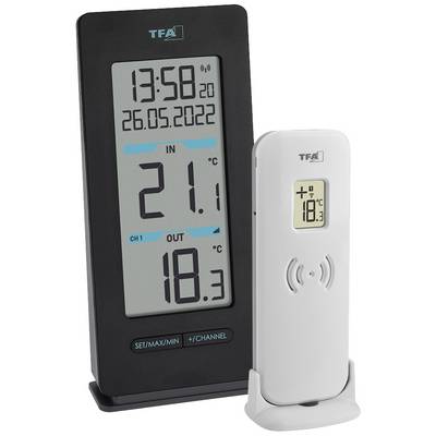 Digitalt termometer med två moduler: En display visar aktuell inomhustemperatur (21,1°C), datum, tid; den andra visar utomhustemperatur (18,3°C).