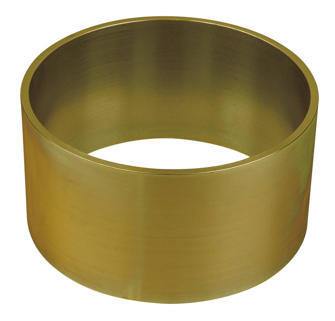 Gyllene metallcylinder, ihålig och stående upprätt.