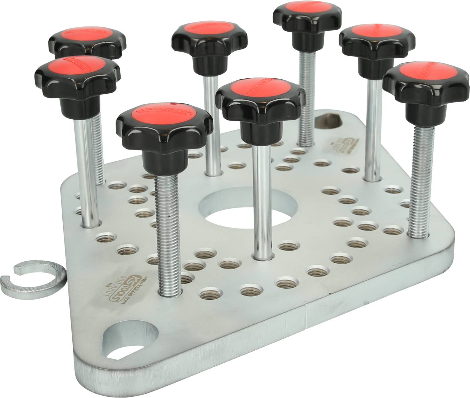 En silvermetallplatta med flera skruvar och röda runda handtag, avsedd för fastsättning eller positionering av arbetsstycken.