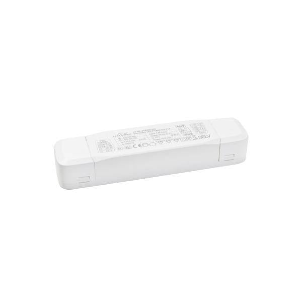En rektangulär, vit elektronisk enhet med switch och säkerhetsmärkningar på ovansidan.