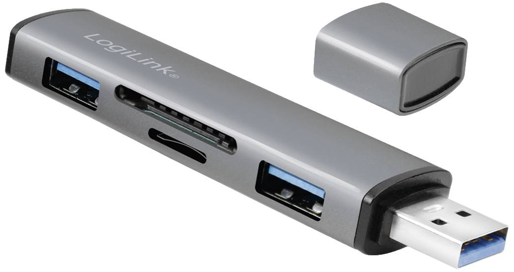 En grå USB-adapter med två USB-portar och kortläsare. Ett avtagbart lock ligger bredvid.