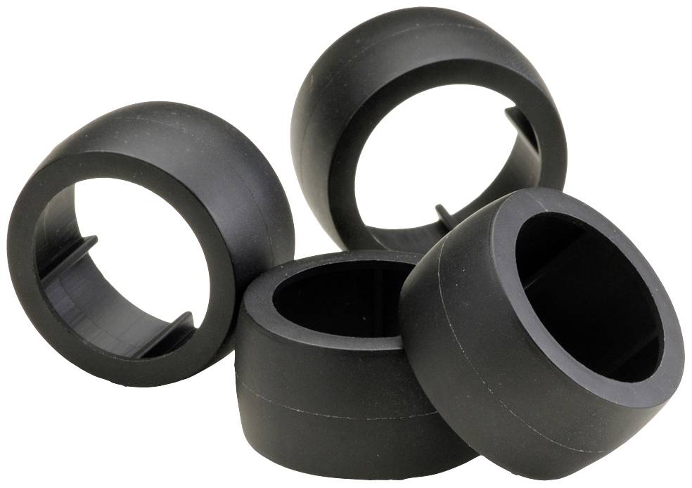 Fyra svarta, cylinderformade plastvalsar är staplade på varandra. De ser robusta ut och verkar vara reservhjul för en apparat.