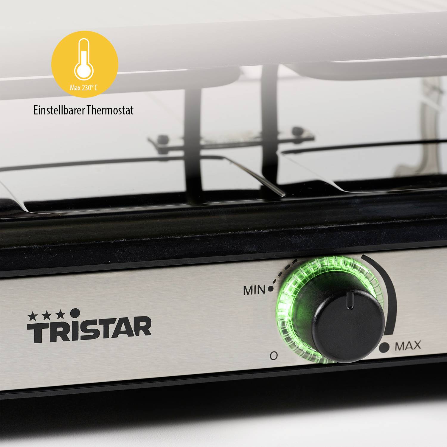 En bild av en Tristar-enhet med en grön lysande vridreglage, inställd på minimal till maximal temperatur med justerbar termostat.