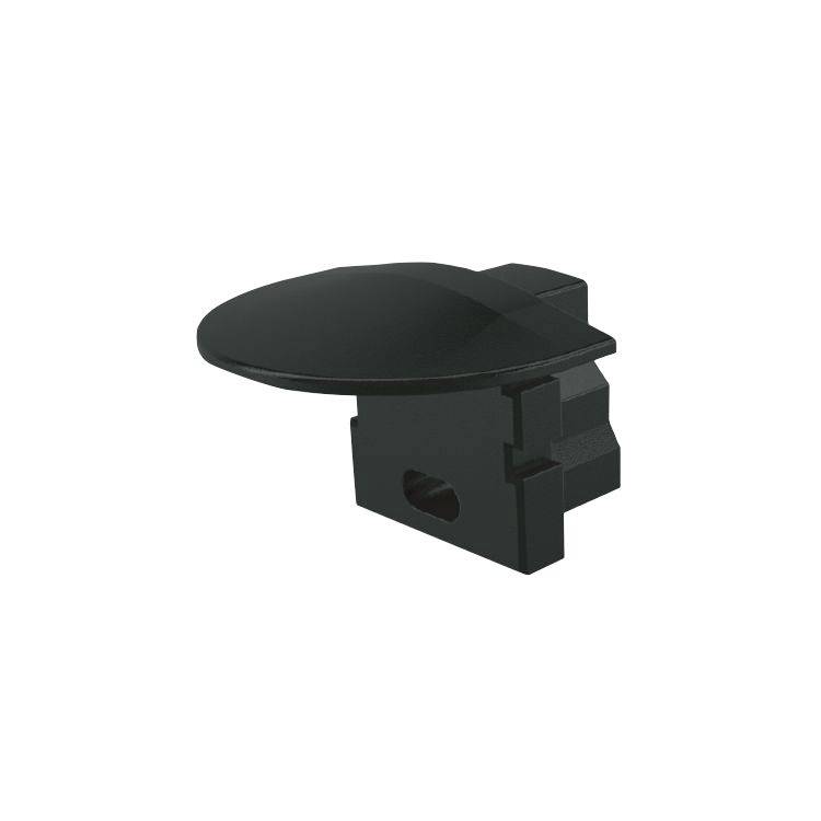 En svart plastdetalj med en plan, oval ovansida och rektangulär bas, sannolikt ett förbindelselement eller en täckskiva.