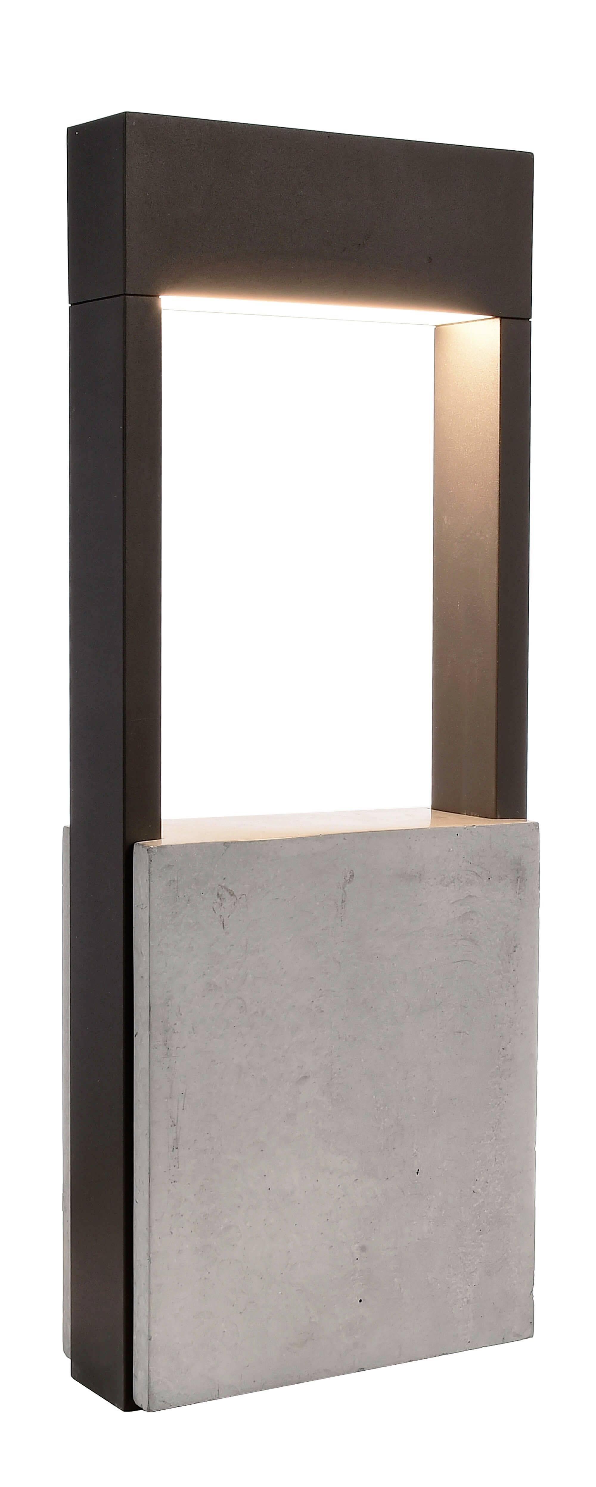 En modern trädgårdsdesign av betong och metall som fungerar som stilfull belysning.