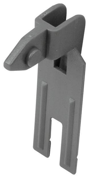 Metallkrok med en skåra längst upp och två pinnar eller taggar nedtill, troligen en del av en mekanisk eller industriell apparat.