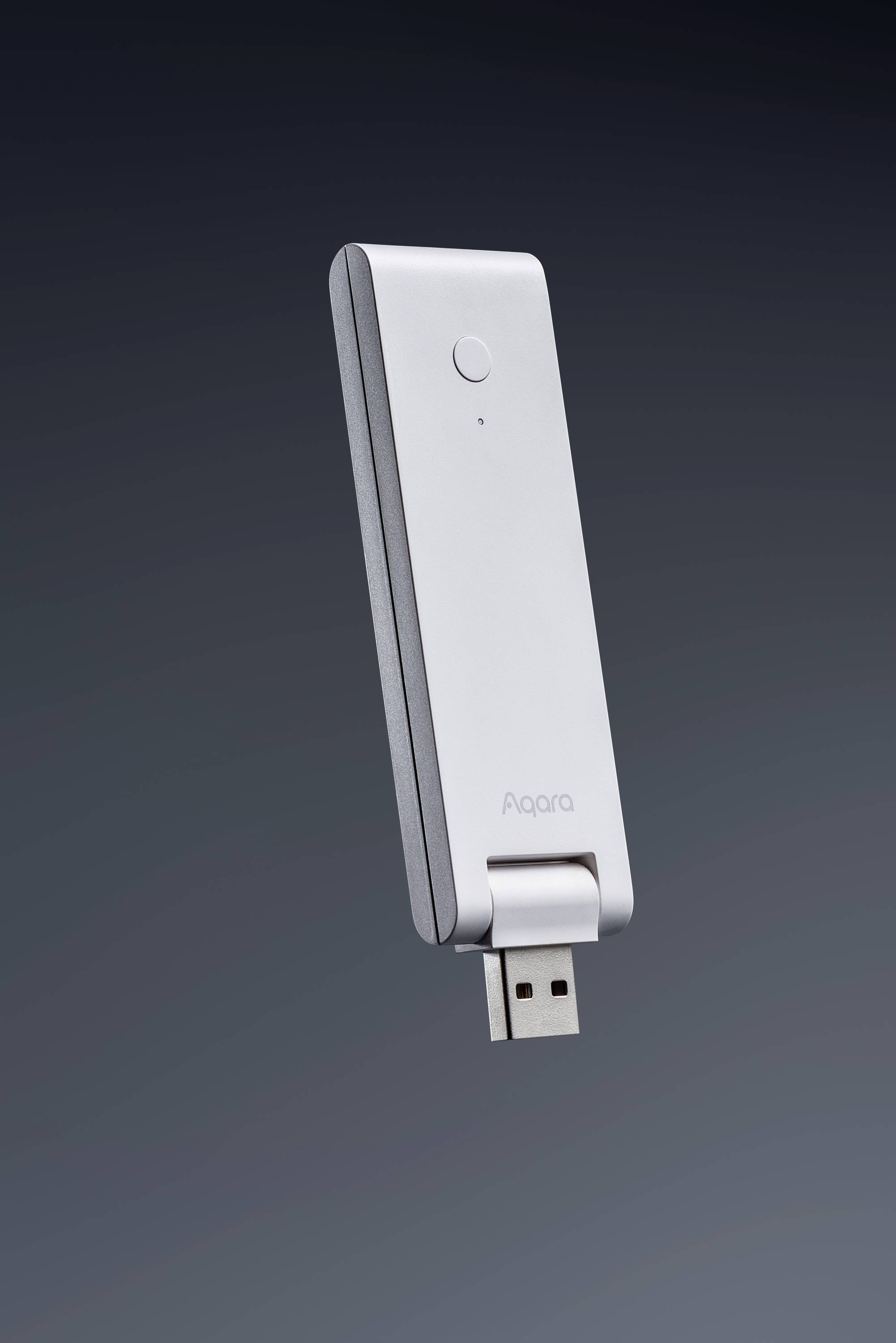 En vit USB-sticka med en LED-indikator och texten 'Aqara', svävar framför en mörk bakgrund.