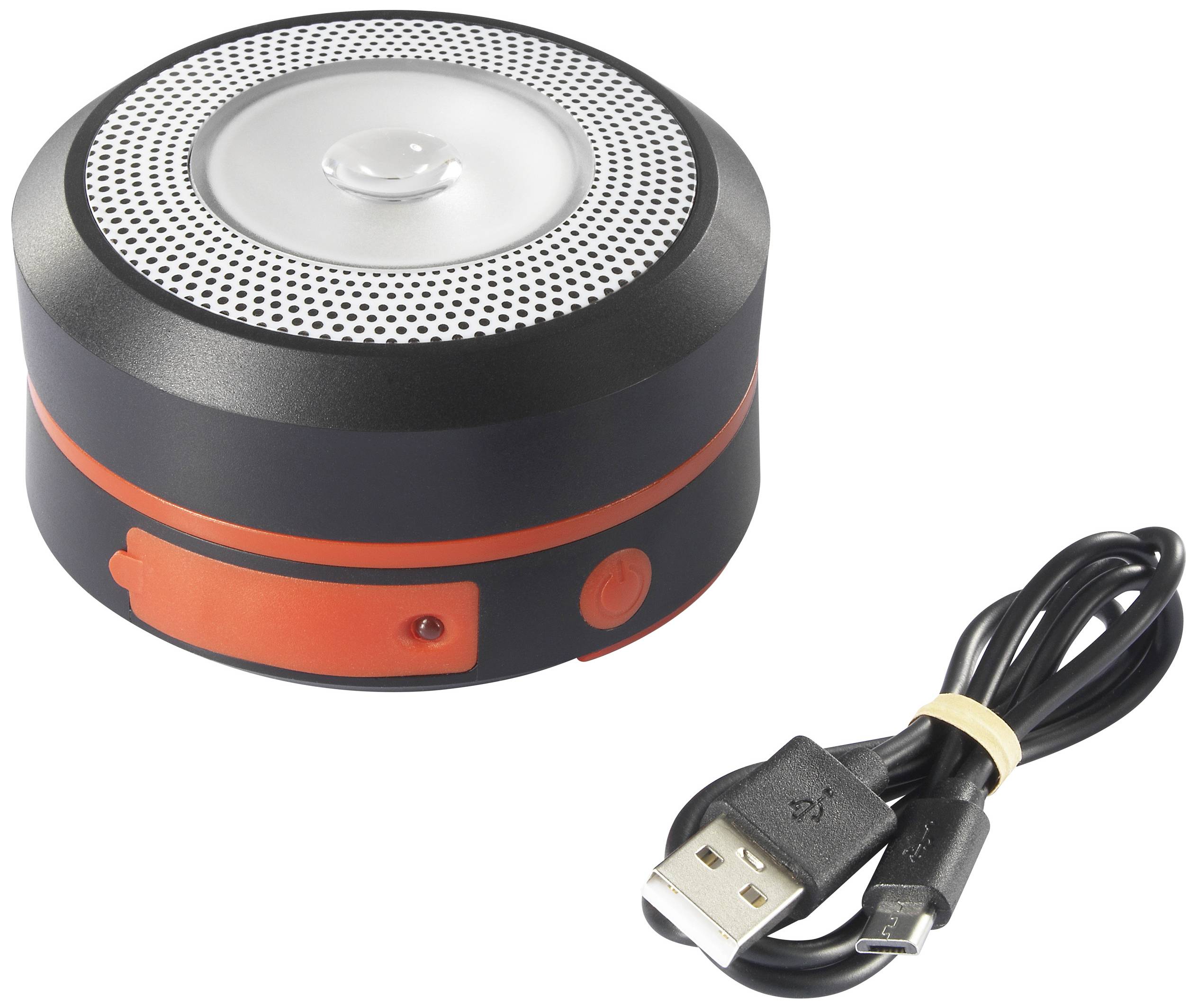 Bärbar, rund Bluetooth-högtalare med svart och rött hölje. Bredvid ligger en USB-laddningskabel.