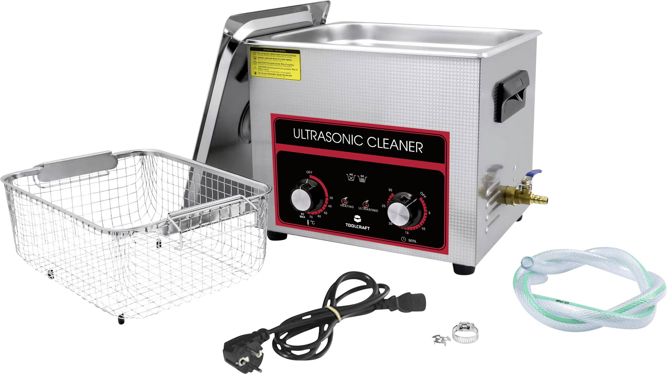 Ultraljudsrengörare med metallkorg, nätsladd och slanguppsättning på vit bakgrund. Kontrollpanelen har temperatur- och timerratt.