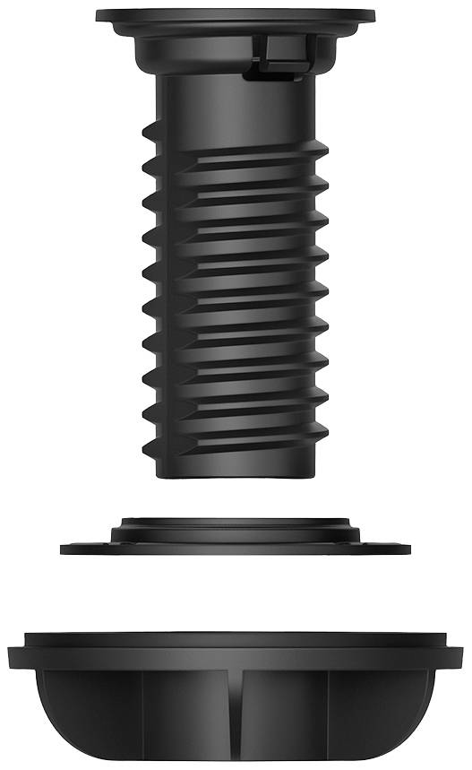 Söndertagen svart, cylindrisk skruvförslutning. Ovan: tandad förslutning. Nedtill: två platta skivor åtskilda.