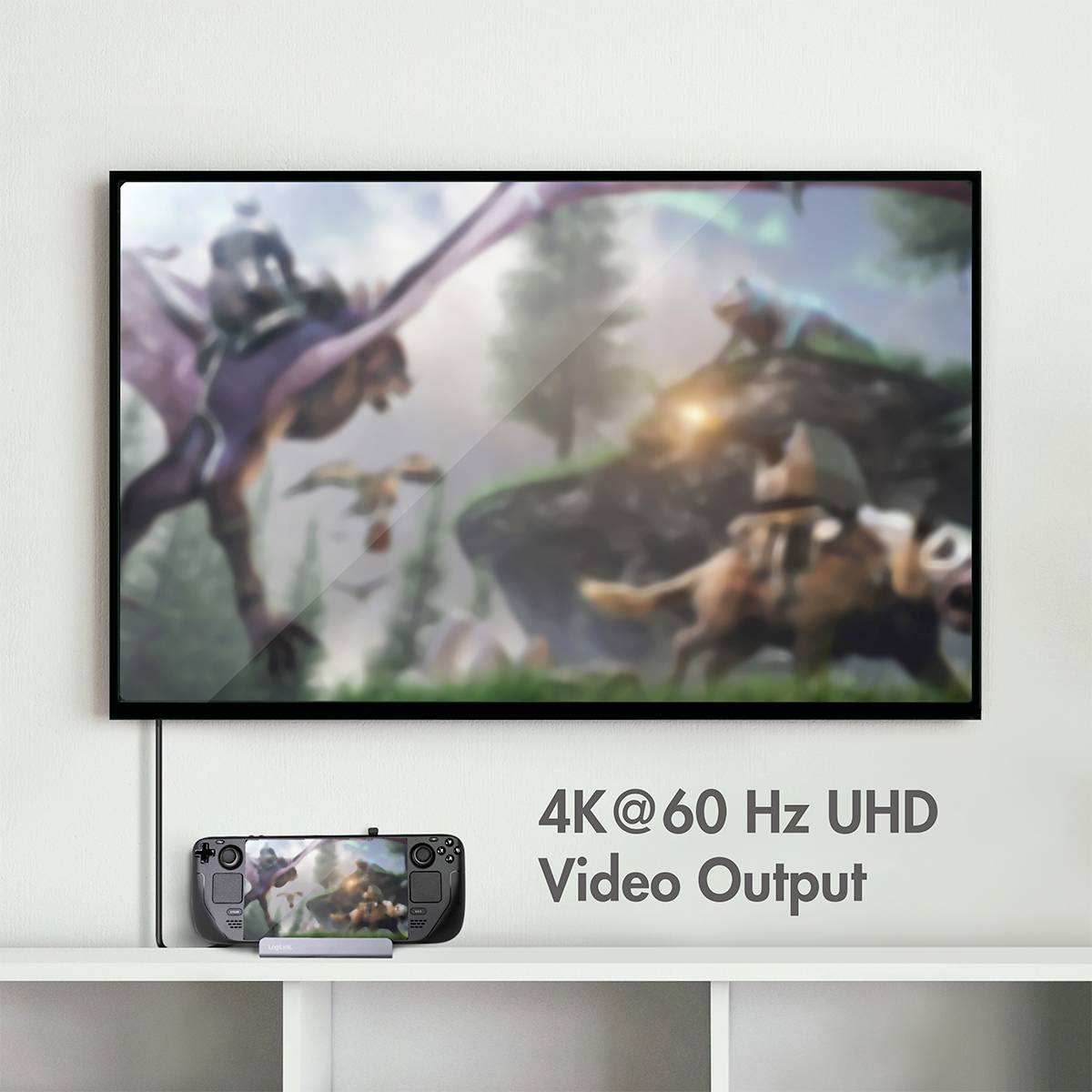 Oskarp bild av en gigantisk fågel och ryttare på djur på en TV-skärm. Under den en handhållen enhet med samma bild, text: '4K@60 Hz UHD Video Output'.