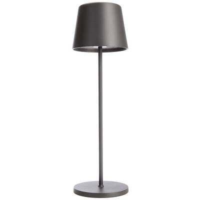 Golvlampa med smal svart fot och konisk svart skärm framför vit bakgrund.