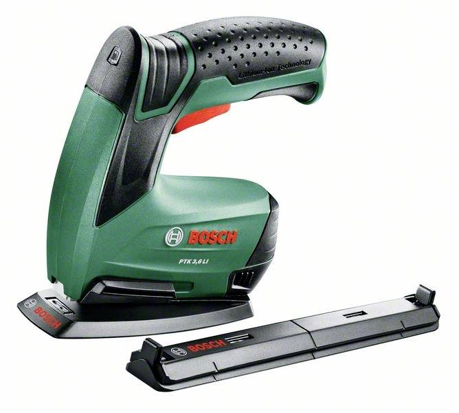 Grüner Bosch elektrisk häftpistol med ergonomiskt handtag. Bredvid ligger ett tillbehör.