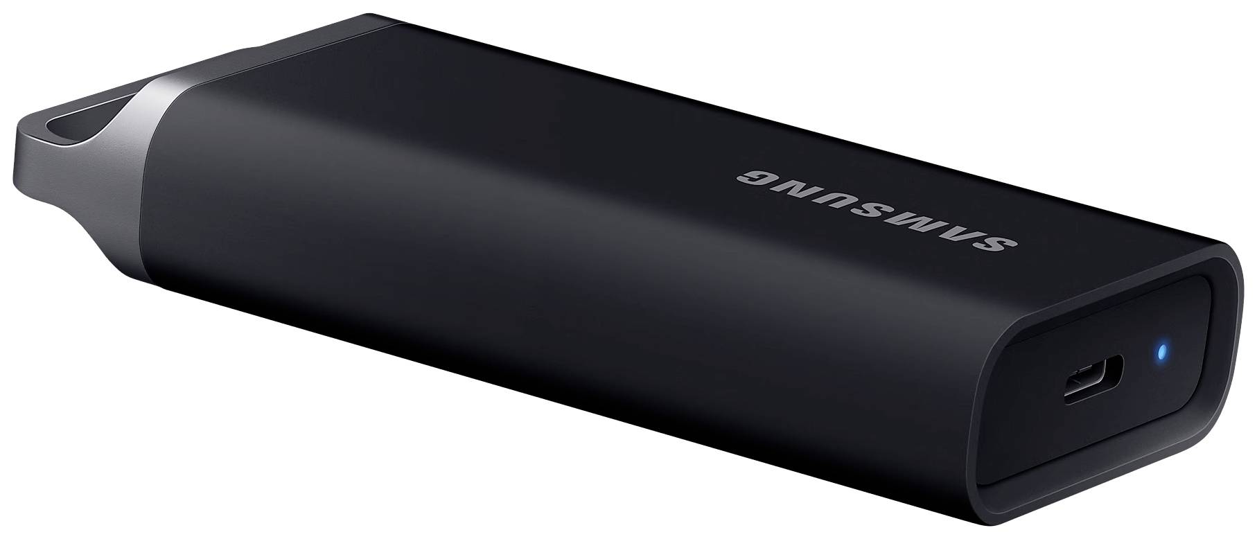 En svart USB-sticka från Samsung med blå lysande LED-indikator och rundad huv, ligger på en vit yta.
