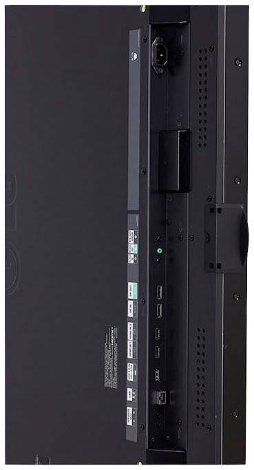 Baksidesvy av en platt skärm med flera anslutningar, däribland HDMI, USB och nätadapteruttag.