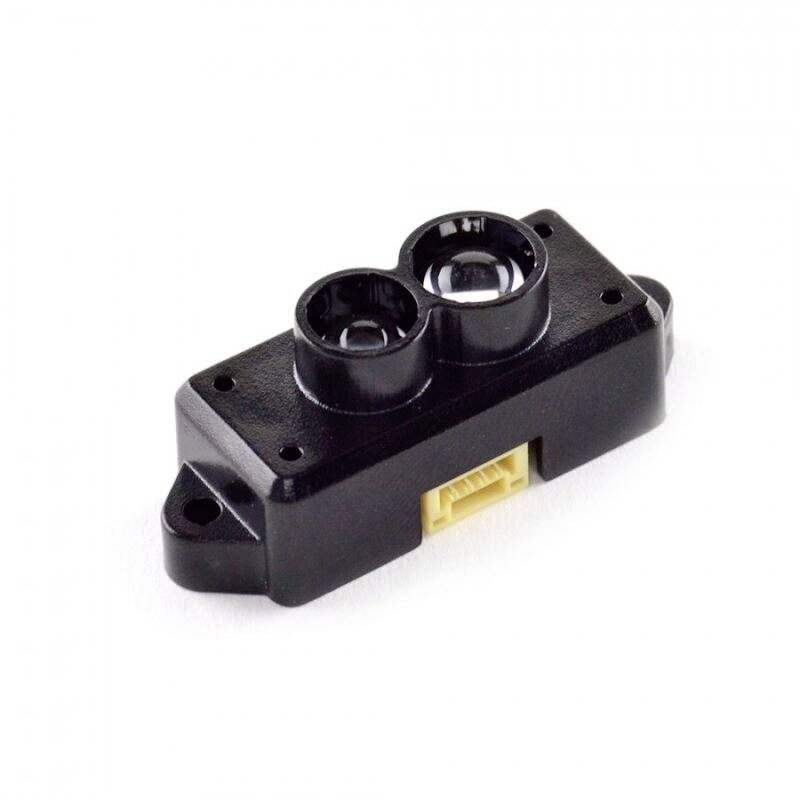En svart infraröd sensor med två optiska linser och en gul kontakt på vit bakgrund.