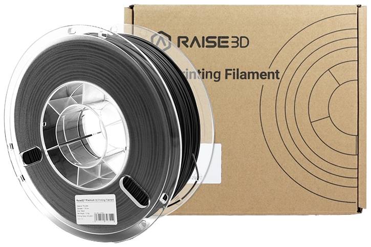 Spole med svart 3D-utskriftsfilament framför en RAISE3D-förpackning.