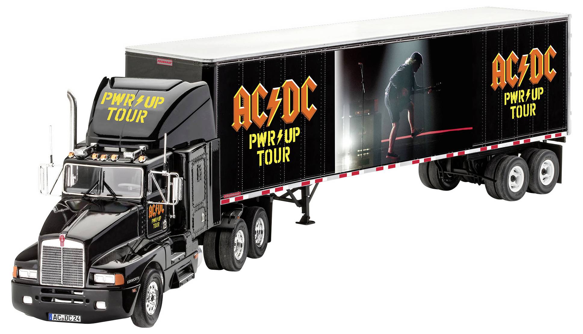 En svart lastbil med trailer, dekorerad med 'AC/DC PWR/UP TOUR'-grafik. En gitarrist syns i strålkastarljuset.