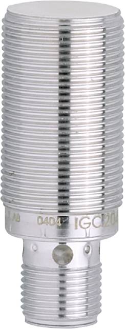En silvermetallmutter med gängad kant som står på en vit yta. Den visar gravyrer eller markeringar.