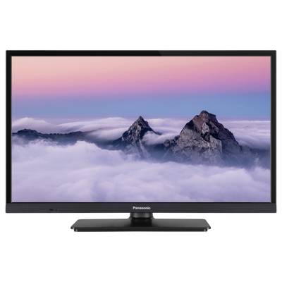 En tv med en bild av berg i dimma och en rosa himmel vid solnedgången.