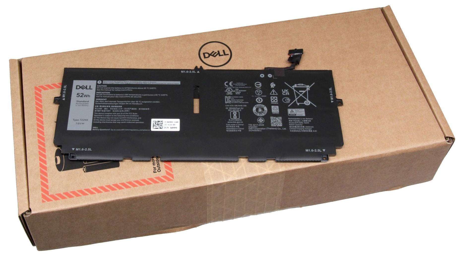 Dell-laptopbatteriet ligger på en Dell-pappask. Batteriet visar specifikationer och symboler för kapacitet och säkerhet.