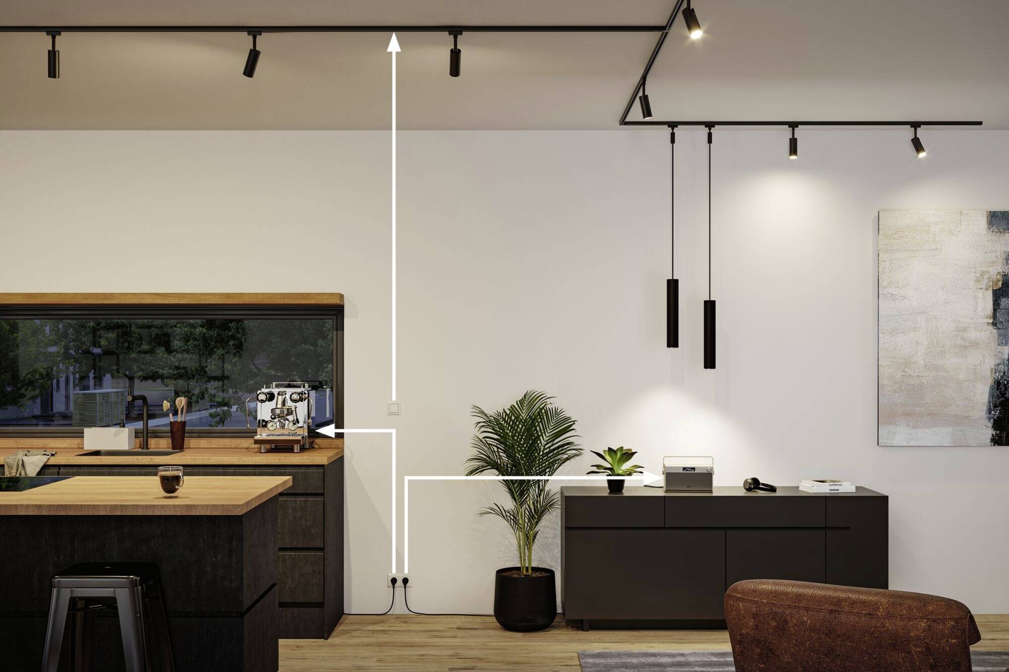 Matrum med modernt design; svarta skåp, central krukväxt och rektangulära hängande lampor. Ljus, minimalistisk miljö.