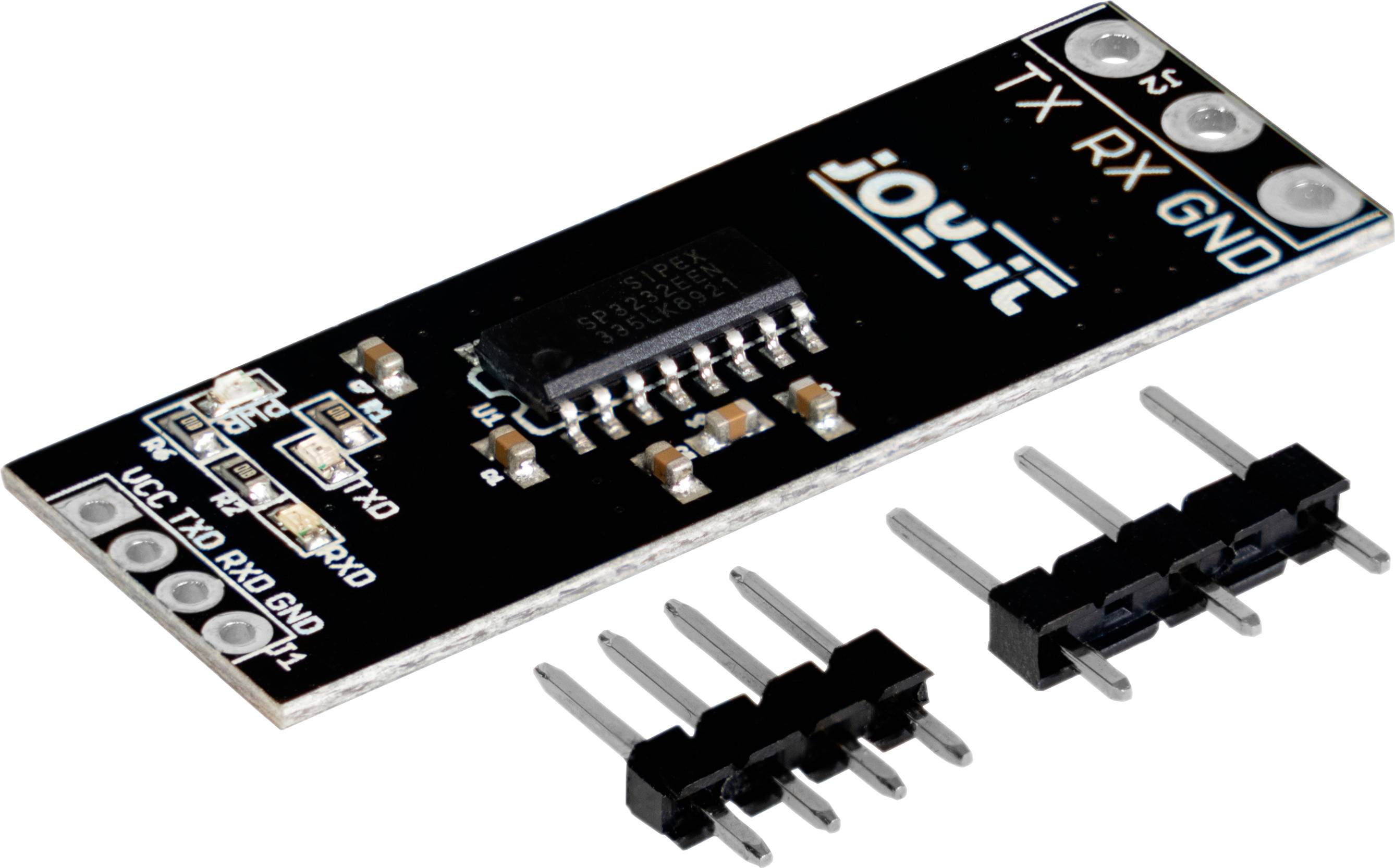 En svart elektronikmodul med chip och stiftlist. Texten 'TX RX GND' är synlig. Kontakt för anslutning eller montering bredvid.