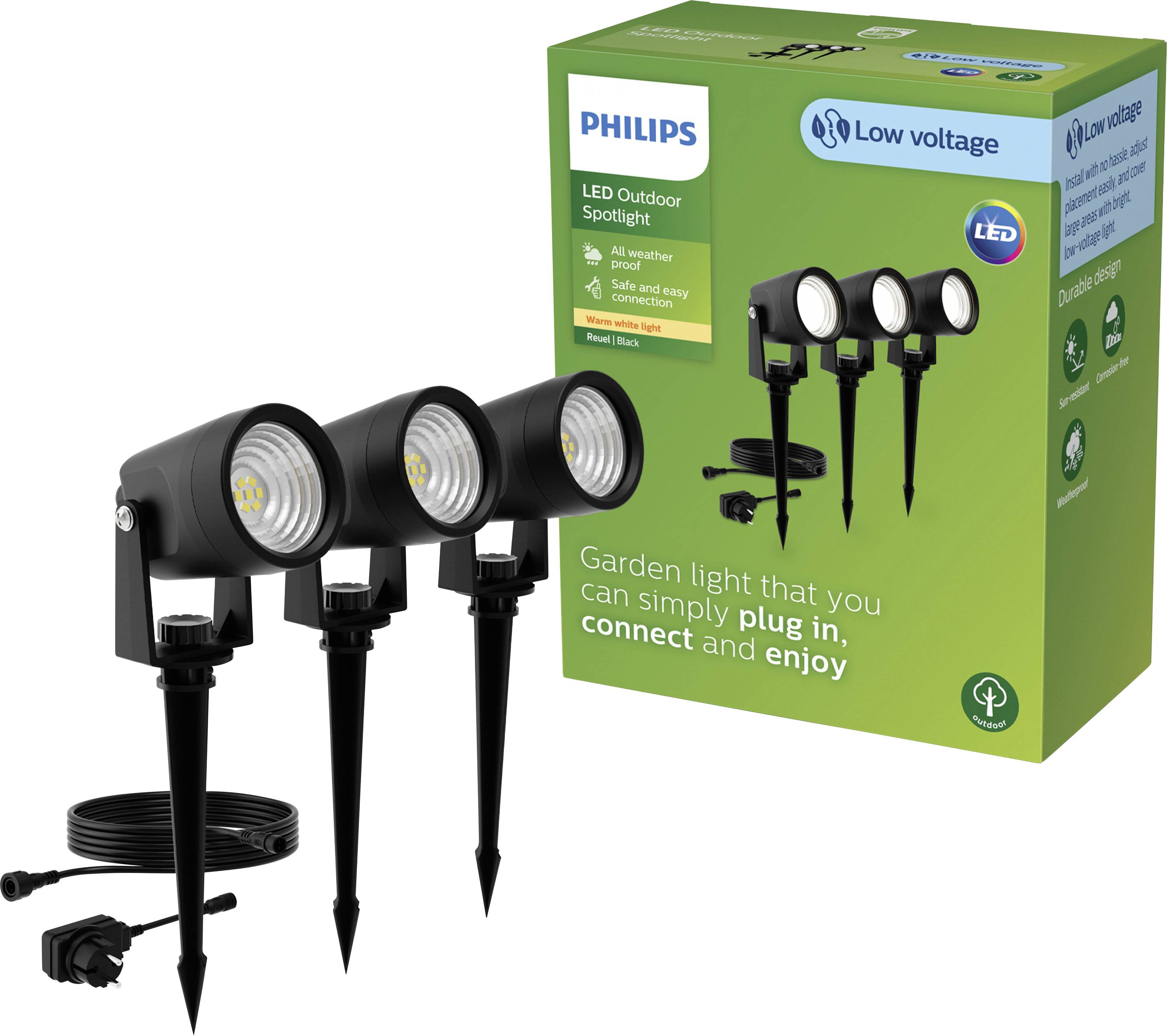 Tre Philips LED-strålkastare med markspett framför en grön förpackning, produktbeskrivningen betonar enkel installation i trädgården.