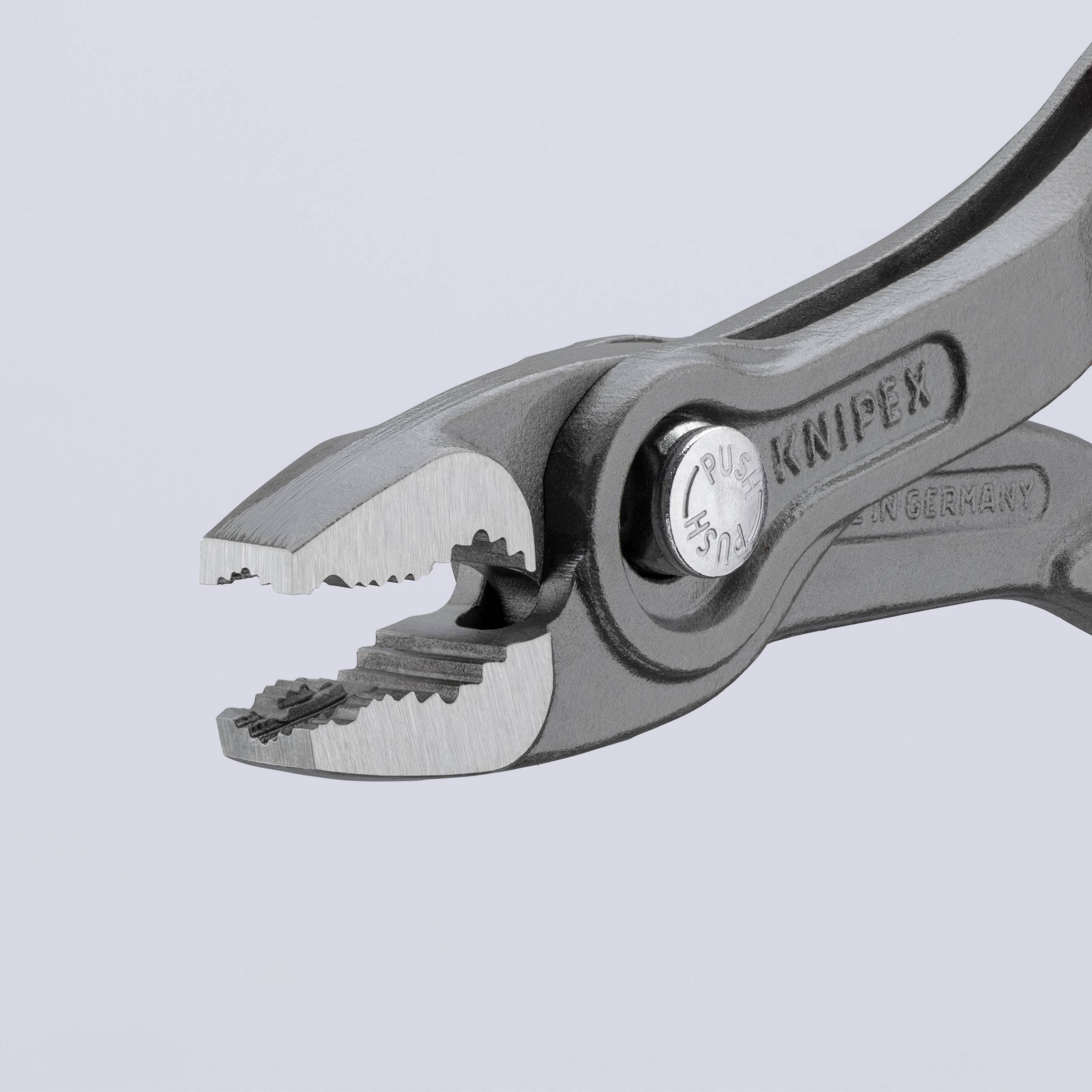 Bilden visar en tång av märket 'Knipex' med en ergonomisk design, specialiserad för precisionsgrepp och klippning.