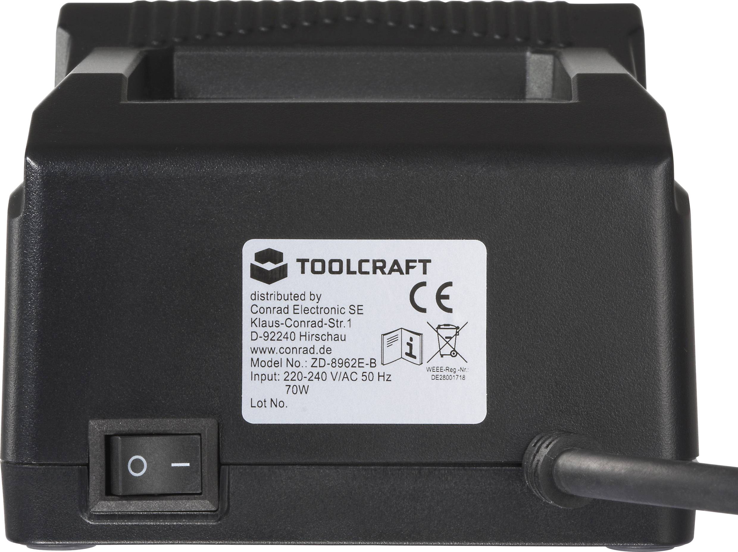 'TOOLCRAFT' svart strömadapter med switch och etikett som visar elektriska specifikationer och efterlevnadsmärken.