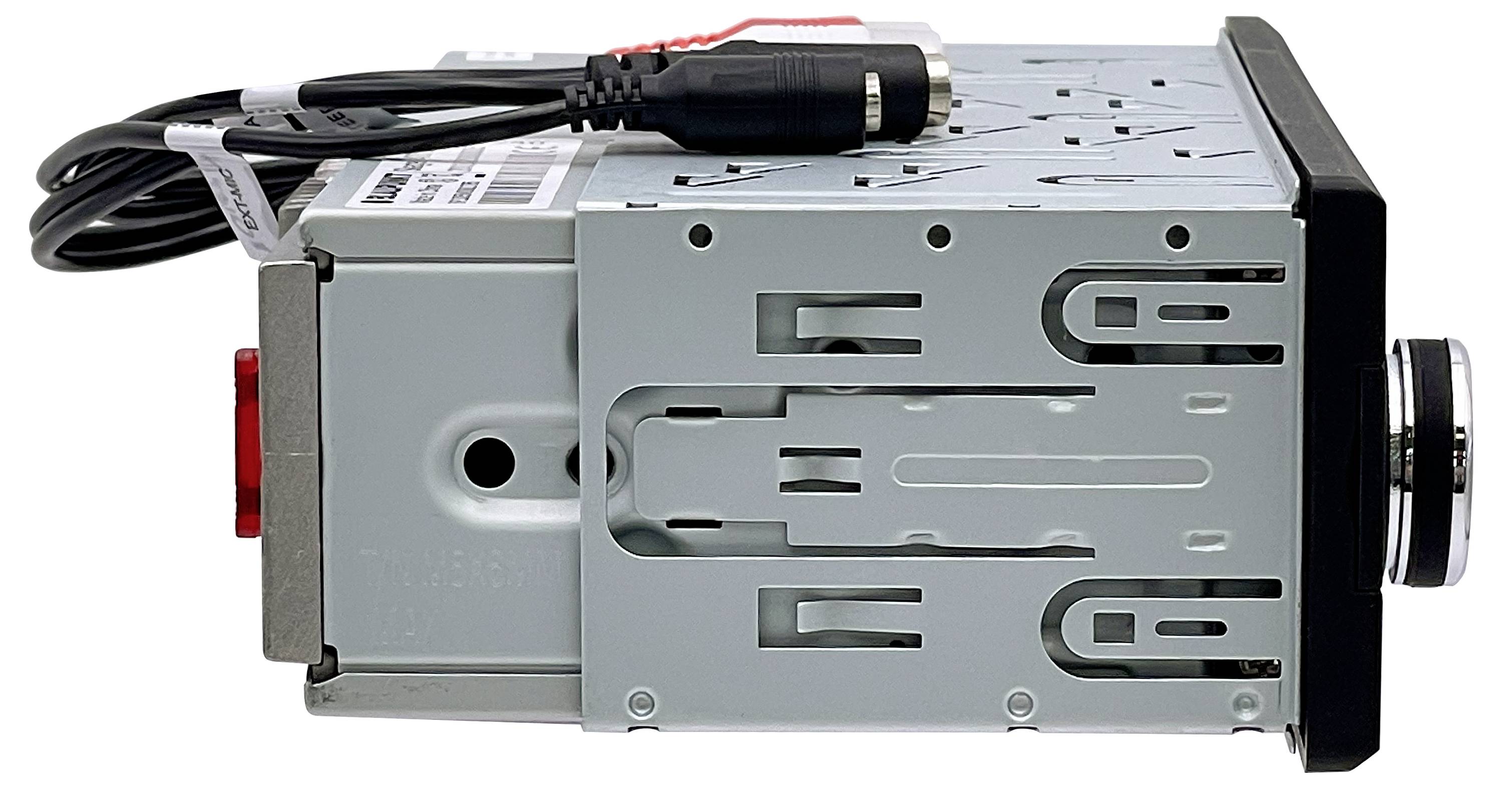 Bilstereo i sidovy, silver hölje, svart manöverpanel med ratt. Anslutningskontakt och kabel synliga ovanifrån.