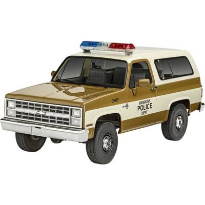 En brun och beige polisbil med texten 'Hawkins Police Dept.' och 'Chief' på dörren. Taket utrustat med röda och blå blåljus.