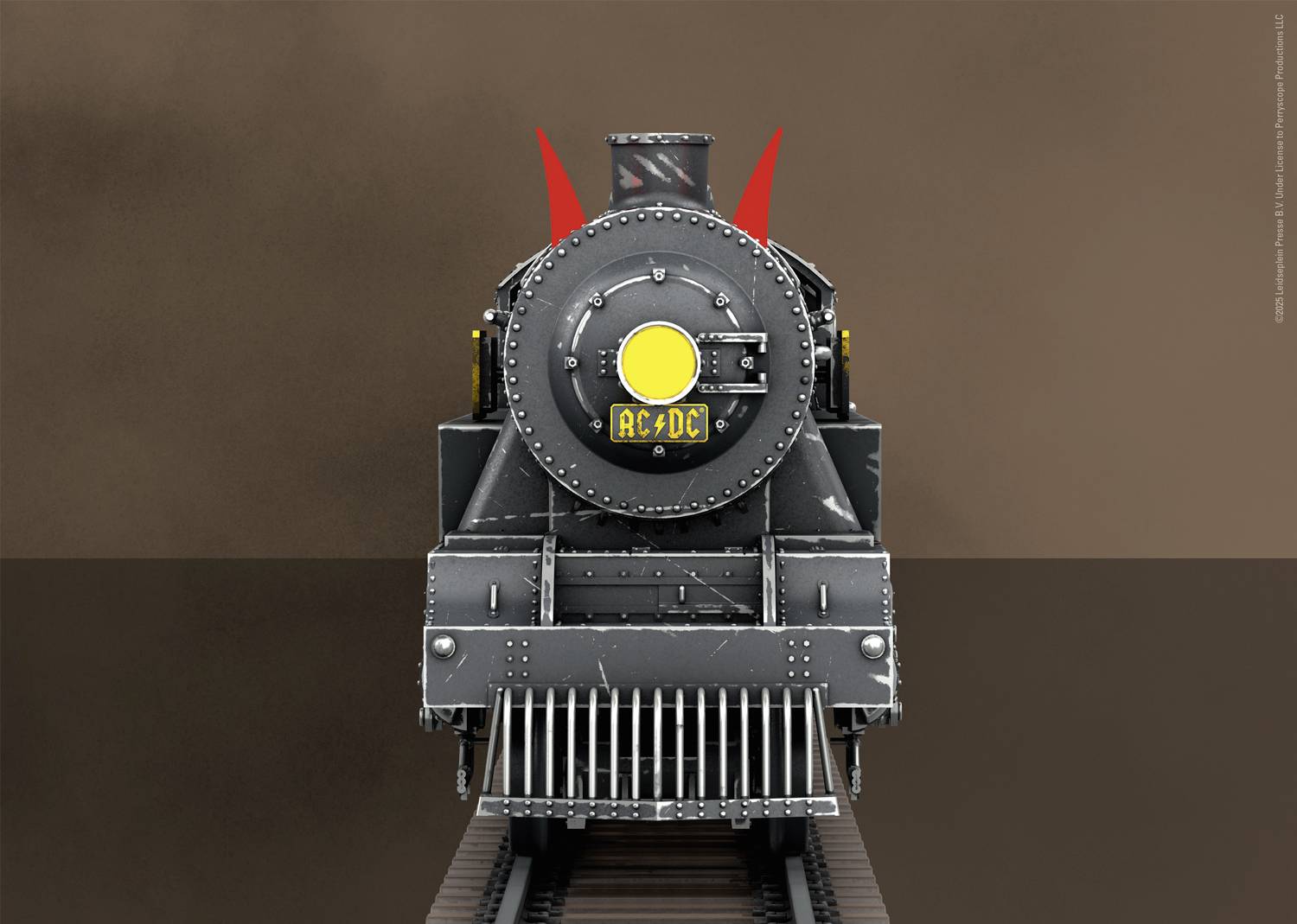 Historiskt ånglok fotograferat framifrån med ett rött djävulshorns-motiv och texten 'AC-DC' på fronten.