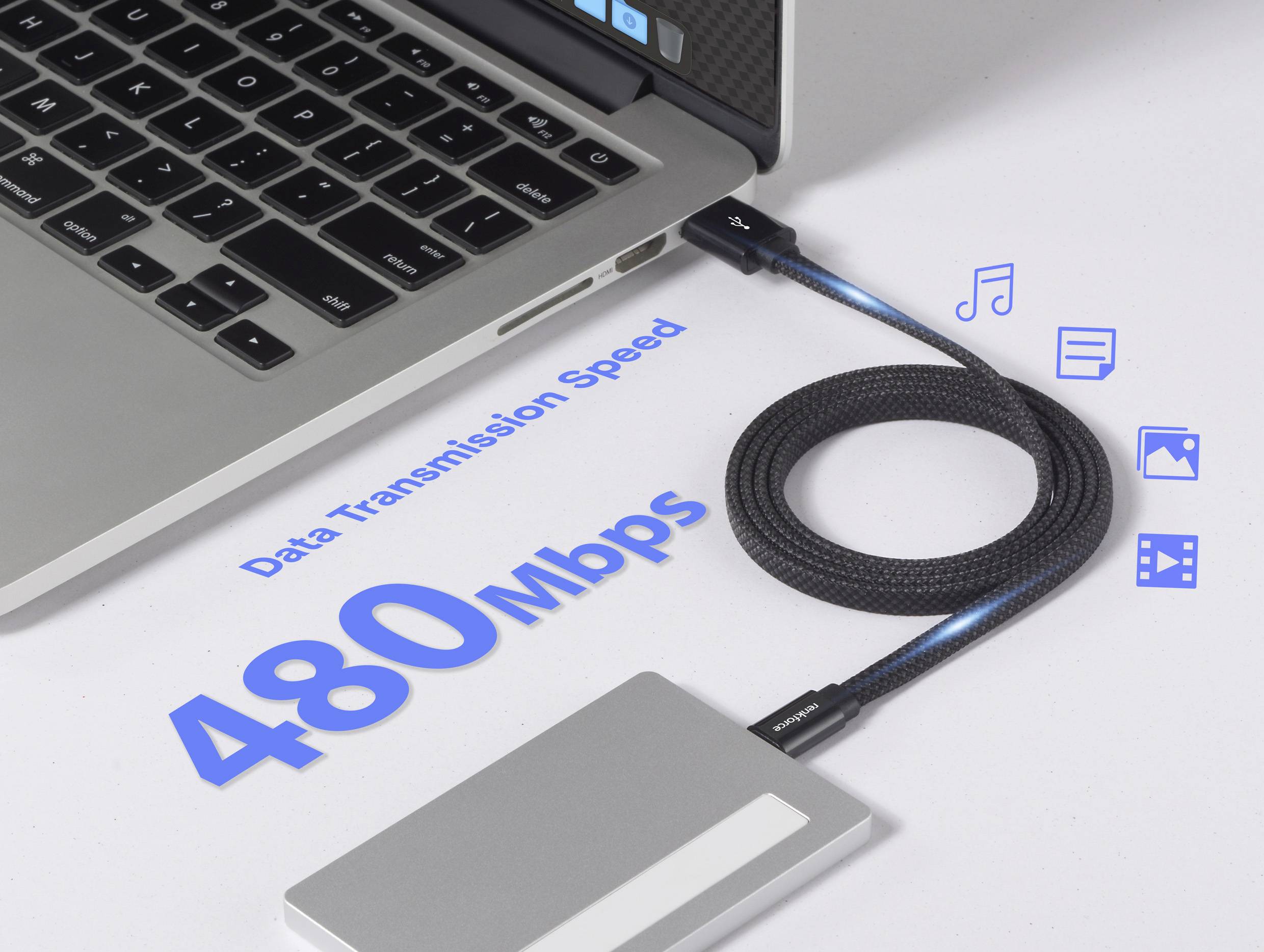 En bärbar dator som är ansluten till en extern enhet via en kabel visas, med betoning på 'Dataöverföringshastighet 480 Mbps' med ikoner för musik, foton och video.