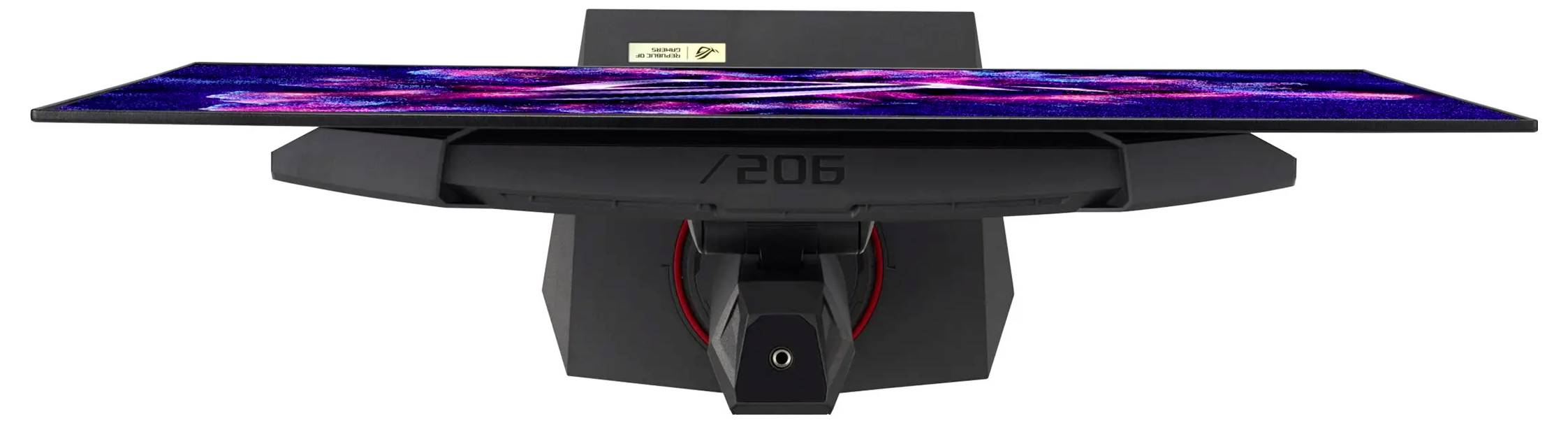 En smal, modern datorskärm med levande färger på skärmen, sedd från nedre bak, med en unik vinklad design.