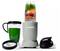 En NutriBullet-mixer fylld med blandade frukter, grönsaker och nötter bredvid en grön dryck i ett glas och ett svart lock.