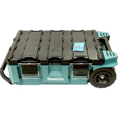 Makita verktygsförvaringsbox med svart lock, två främre hakar, hjul på höger sida och ett handtag. Innehåller en liten blå manual ovanpå.