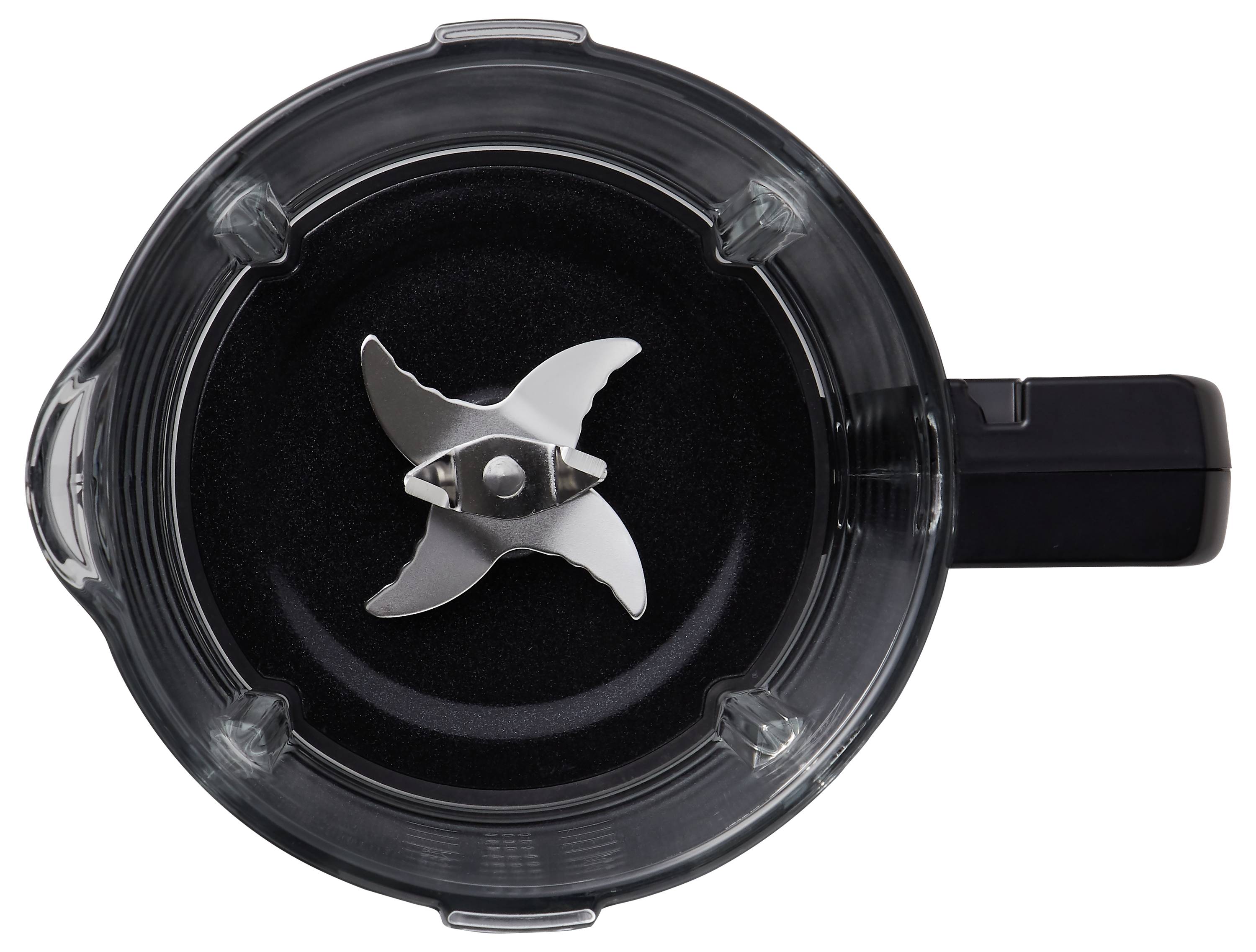 Ovanifrån av en mixerkanna med en metallkniv inuti.