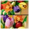 Lego-blommor i livliga färger, inklusive orange, lila, rosa och röd, arrangerade i en bukett.