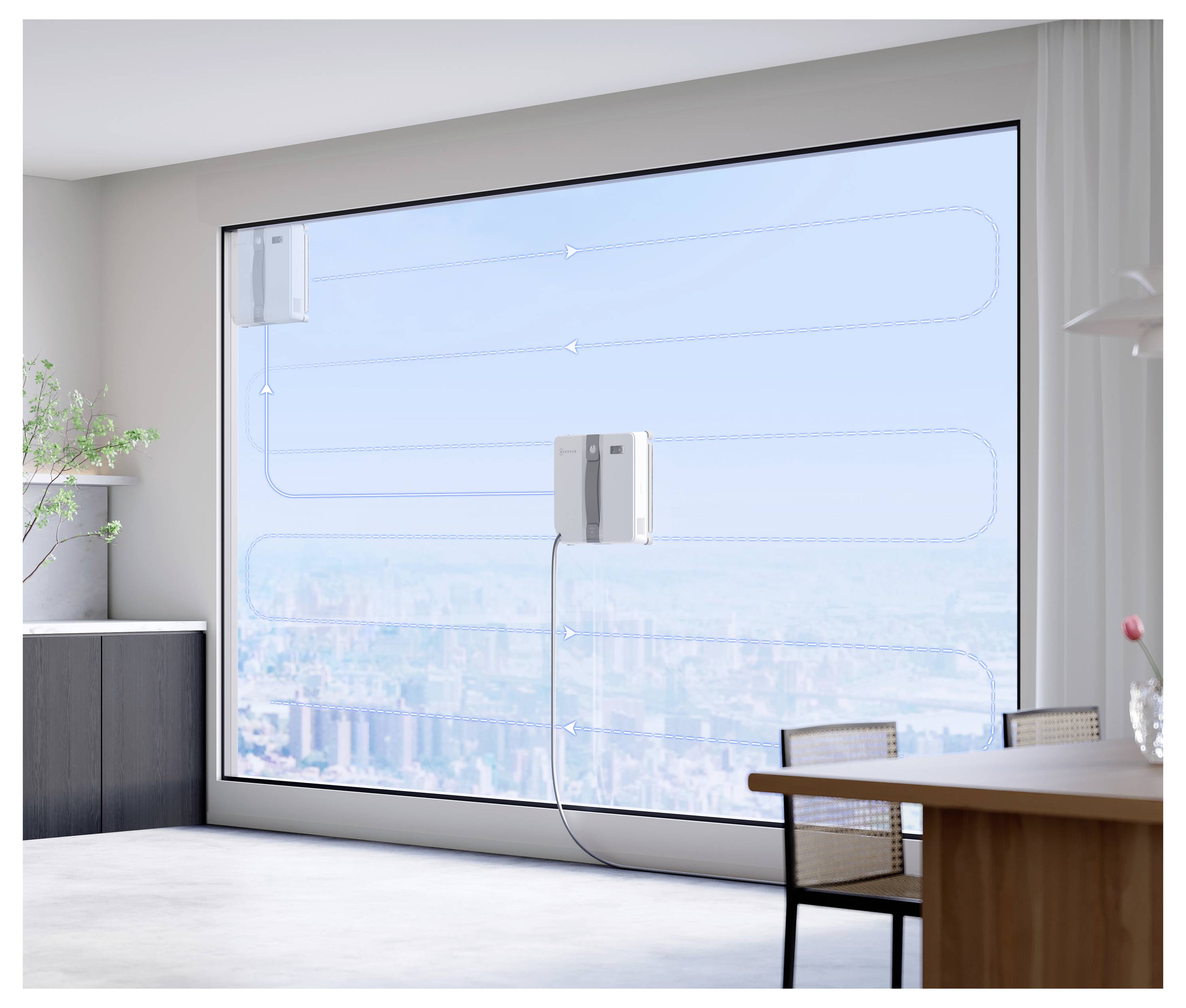 En smart enhet är fäst vid ett stort fönster och visar en stadsutsikt. Den visar luftflödesmönster, vilket tyder på övervakning av luftkvalitet.