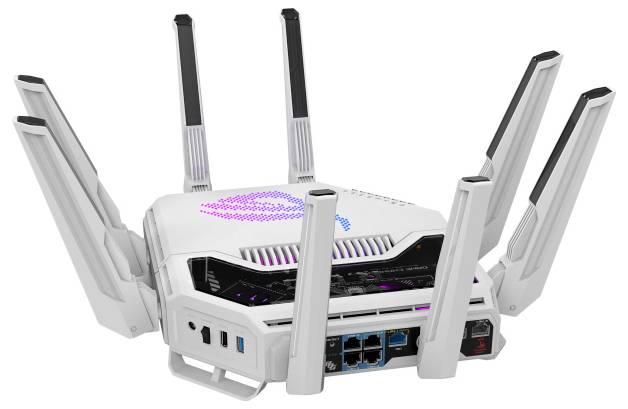 En vit trådlös router med flera antenner, utrustad med färgglada LED-lampor på ovansidan.