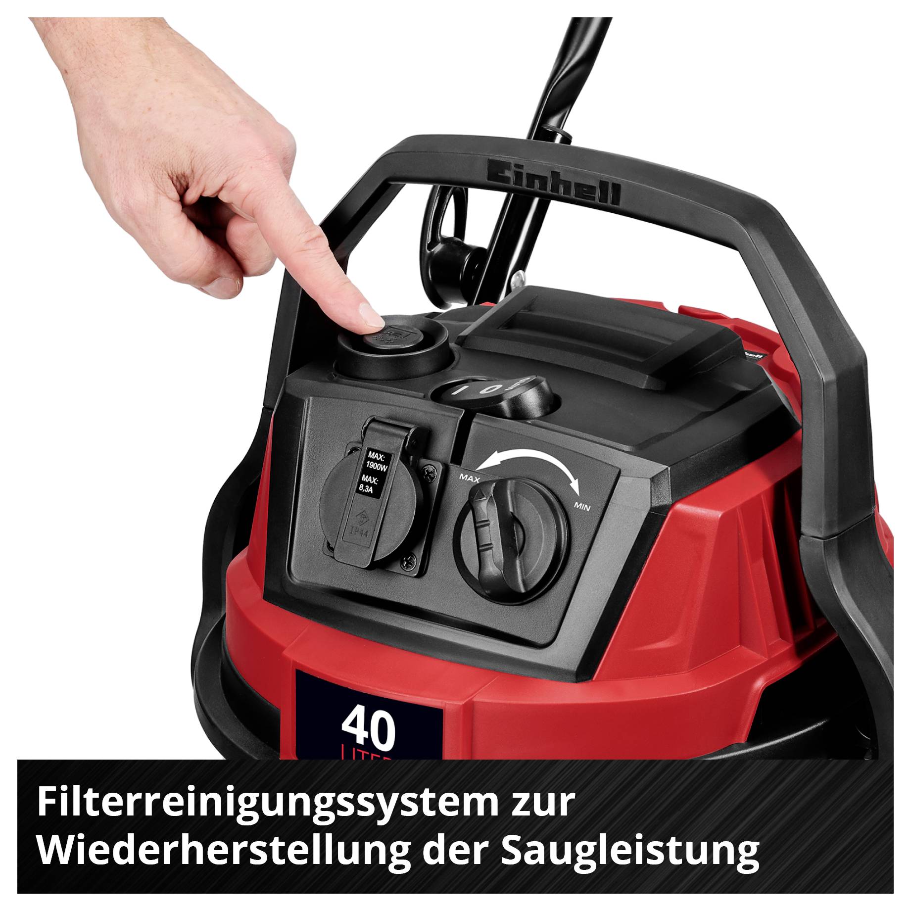 Handen pekar på manöveregenskaper hos en röd-svart dammsugare märkt med 'Filtersaneringssystem för återställning av sugkraft'.