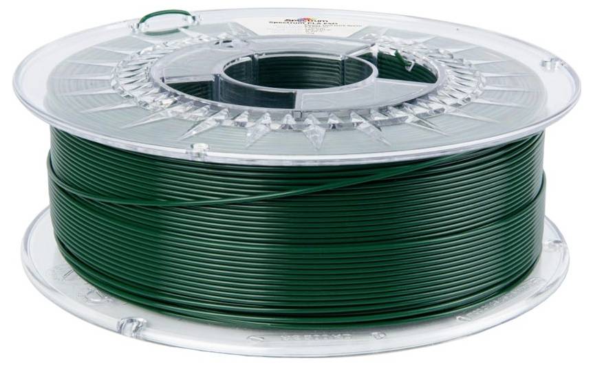 Spole av mörkgrönt filament eller tråd lindad på en transparent plastskiva, isolerad på vit bakgrund.