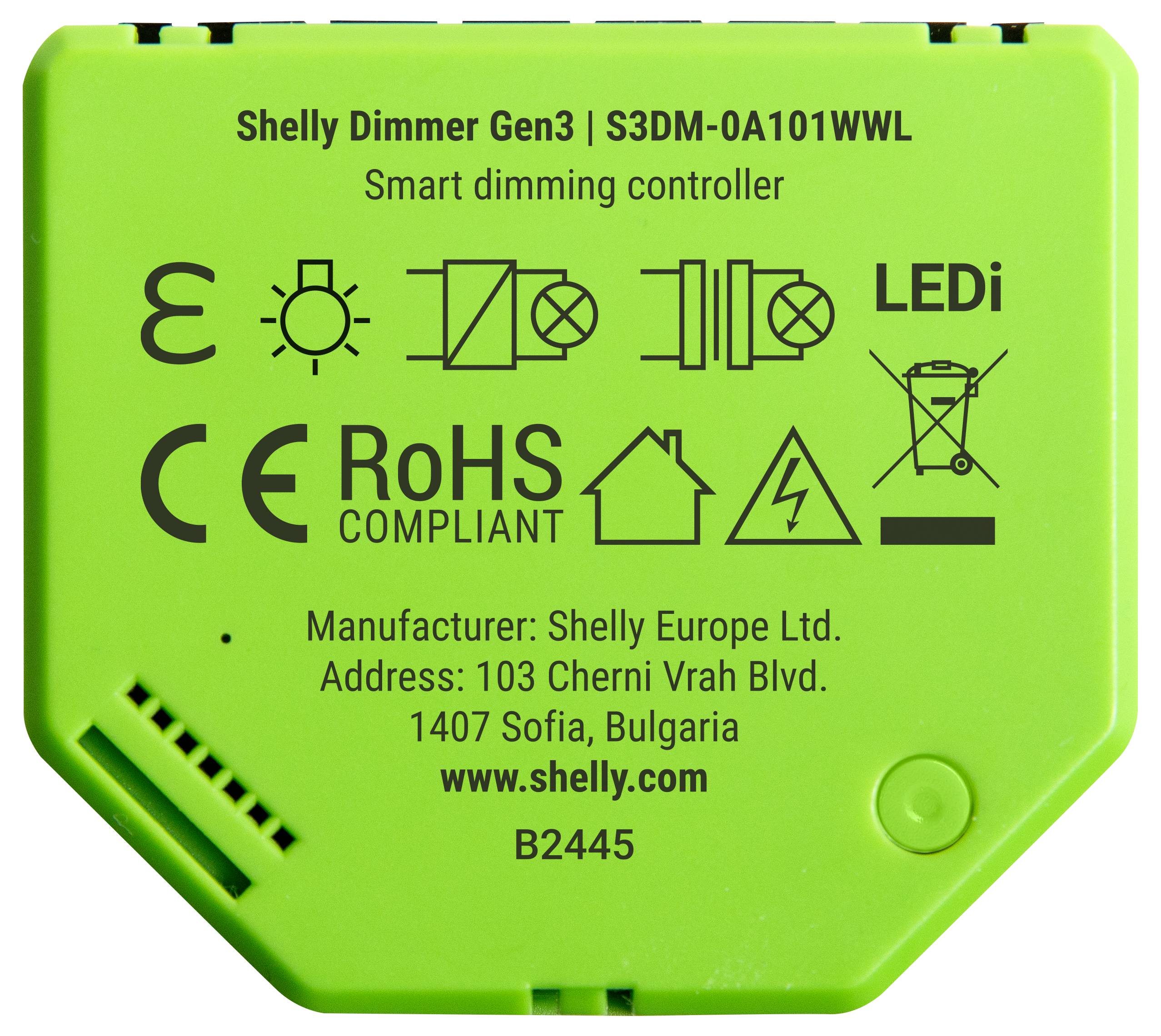 'Green Shelly Dimmer Gen3 S3DM-0A101WWL-enhet med överensstämmelsesymboler, LEDi-märkning och tillverkarnas information inklusive adress.'