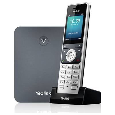 En trådlös Yealink-telefon med en digital display som visar tid och datum, placerad på sin laddningsstation, bredvid en Wi-Fi-aktiverad basenhet.