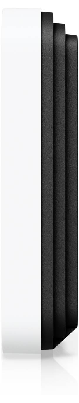 En vit och svart rektangulär elektronisk enhet med en skiktad design, möjligen en modem eller router, visad i sidovy.