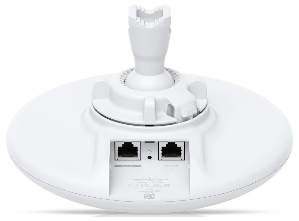 En vit, cirkulär elektronisk enhet med två Ethernet-portar och en monteringsfäste på toppen, troligtvis en nätverksantenn eller åtkomstpunkt.