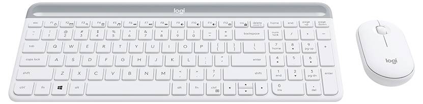 Vit Logitech trådlös tangentbord med numeriskt tangentbord och matchande vit mus på en enkel bakgrund.